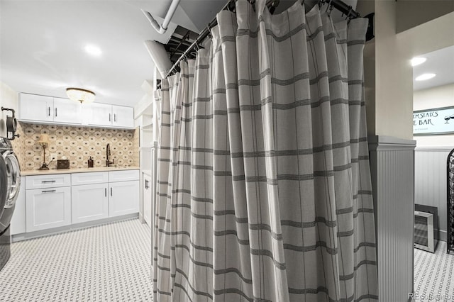 1414 S Vine St, Denver, CO 80210 - full bathroom with vanity, backsplash, and a shower with shower curtain