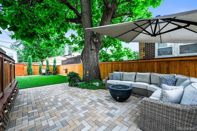 1414 S Vine St, Denver, CO 80210 - fenced backyard featuring an outdoor living space with a fire pit and a patio