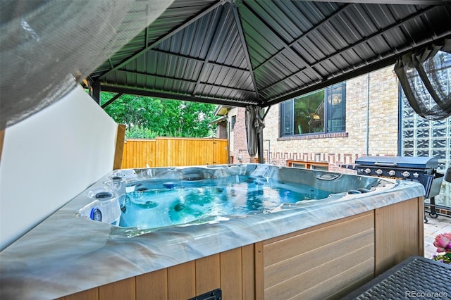 1414 S Vine St, Denver, CO 80210 - view of patio with a hot tub, a gazebo, and a grill