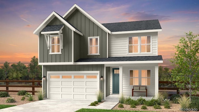 view of front facade with concrete driveway, roof with shingles, an attached garage, fence, and board and batten siding