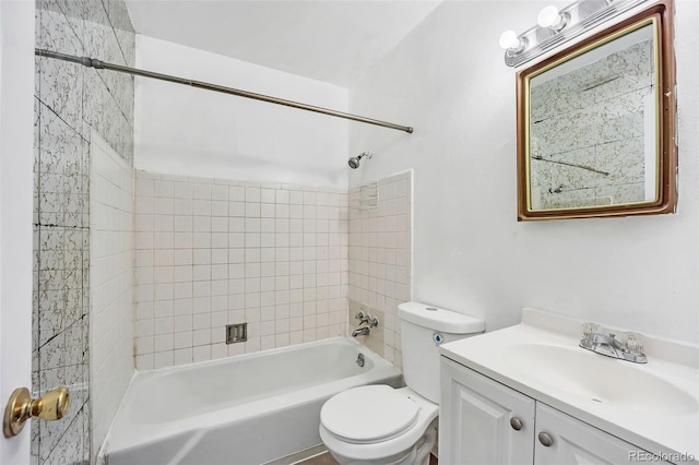 full bathroom featuring vanity, toilet, and tiled shower / bath