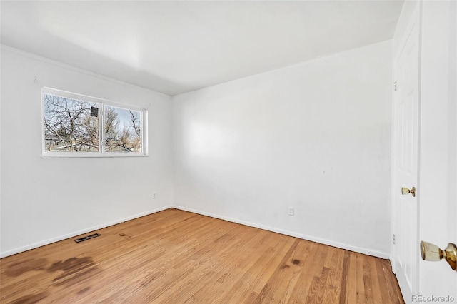 unfurnished room with light hardwood / wood-style floors