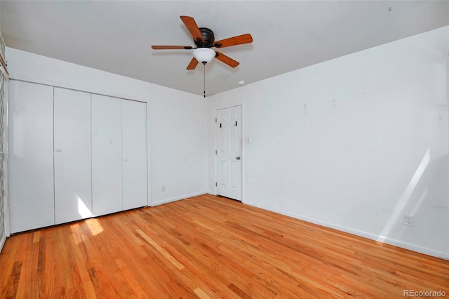 1822 N Circle Dr, Colorado Springs, CO 80909 - unfurnished bedroom with wood finished floors, a closet, baseboards, and a ceiling fan