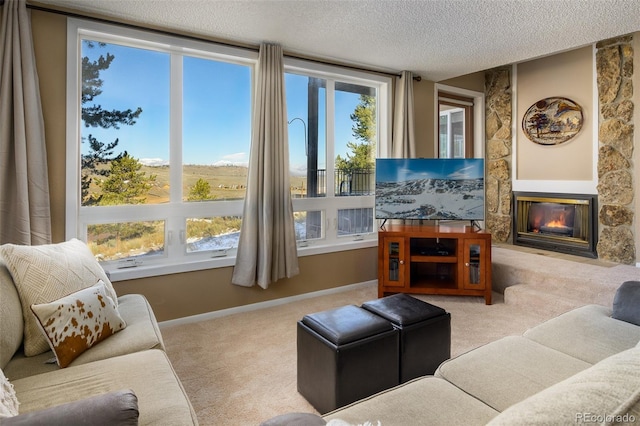 carpeted living room with a fireplace and a textured ceiling