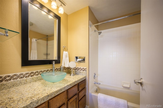 bathroom with shower / bath combo and vanity