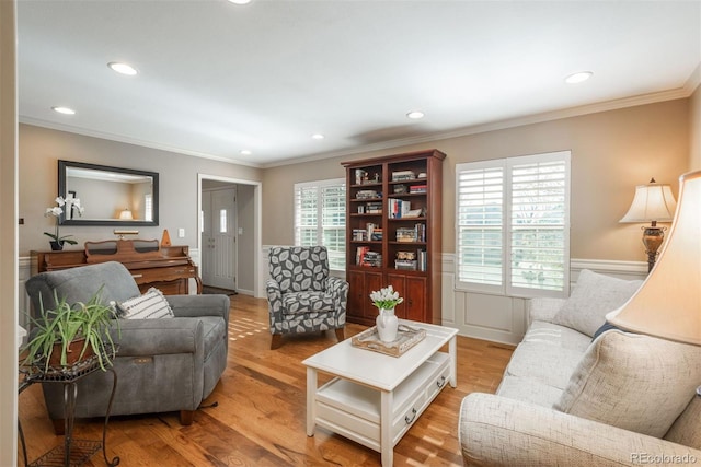 living room with crown molding and recessed lighting