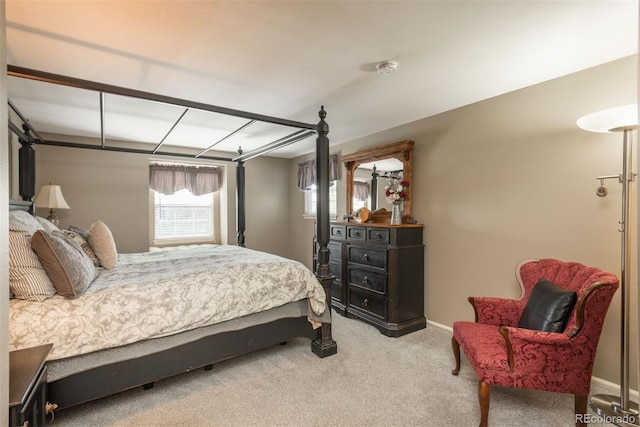 bedroom with baseboards and carpet