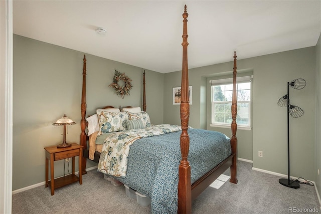 bedroom featuring baseboards and carpet