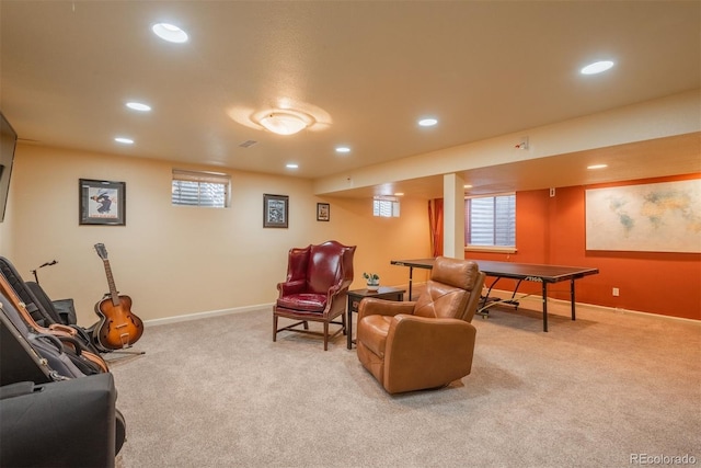 living room featuring a healthy amount of sunlight, baseboards, recessed lighting, and light colored carpet