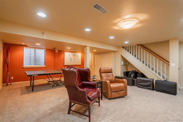 carpeted living area with visible vents, recessed lighting, baseboards, and stairway