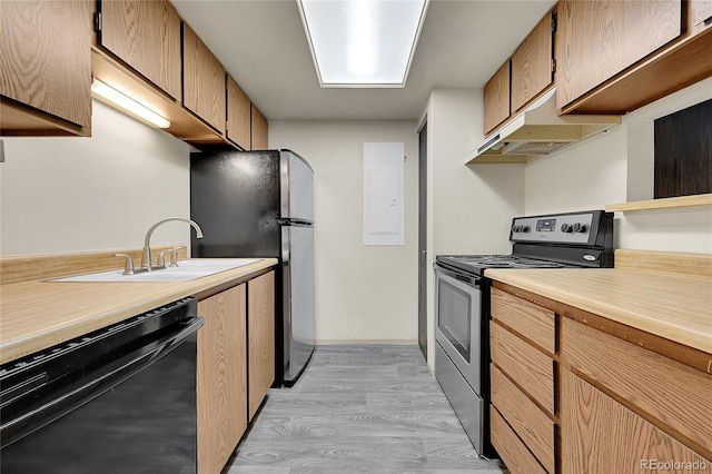 1830 S Pitkin Cir Unit B, Aurora, CO 80017 - kitchen with appliances with stainless steel finishes, under cabinet range hood, light countertops, light wood-style floors, and electric panel