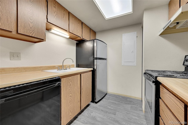 1830 S Pitkin Cir Unit B, Aurora, CO 80017 - kitchen with stainless steel appliances, under cabinet range hood, light wood-style floors, and electric panel