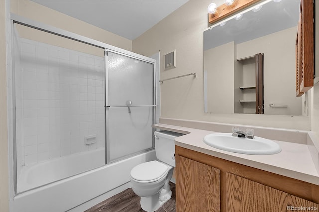 1830 S Pitkin Cir Unit B, Aurora, CO 80017 - bathroom with wood finished floors, vanity, and shower / bath combination with glass door