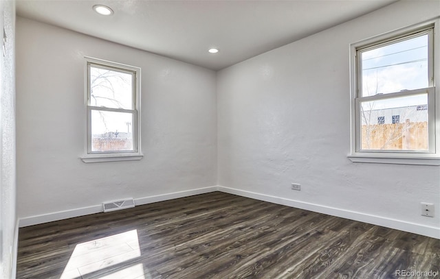 empty room featuring dark wood-type flooring