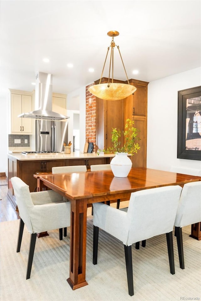 dining room with recessed lighting