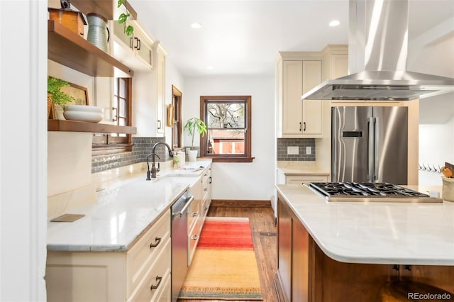 kitchen with open shelves, light wood-style floors, island range hood, tasteful backsplash, and stainless steel appliances