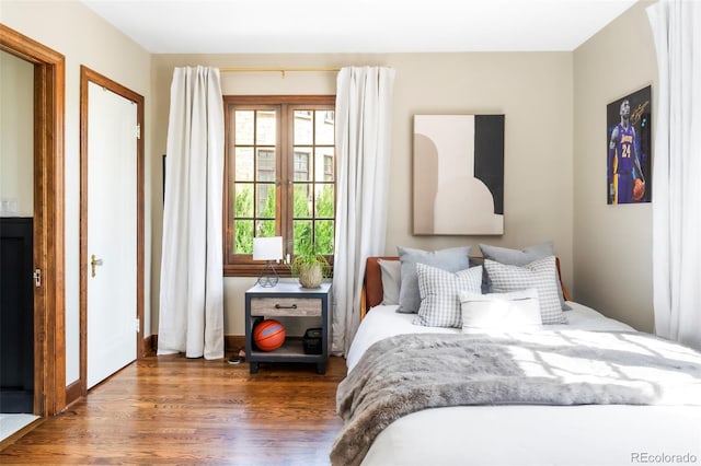 bedroom featuring wood finished floors