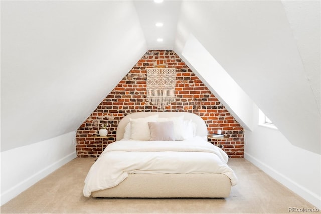carpeted bedroom featuring baseboards, recessed lighting, lofted ceiling, and brick wall