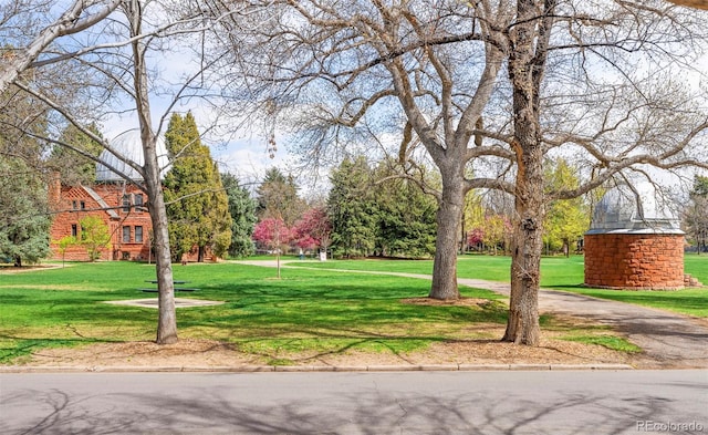 view of home's community featuring a lawn