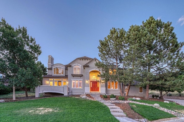 view of front of home with a front lawn