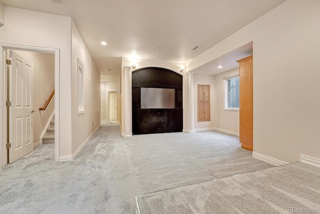 unfurnished living room with light carpet