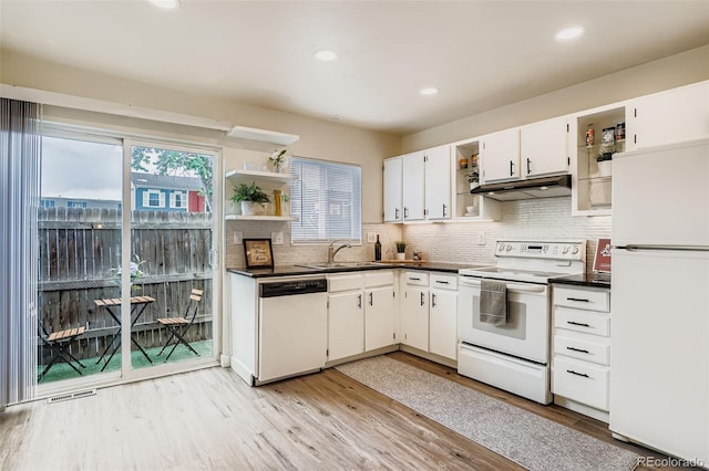 15775 E 13th Pl, Aurora, CO 80011 - kitchen with open shelves, white appliances, dark countertops, white cabinetry, and recessed lighting