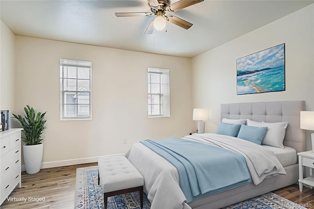 15775 E 13th Pl, Aurora, CO 80011 - bedroom with light wood finished floors and ceiling fan