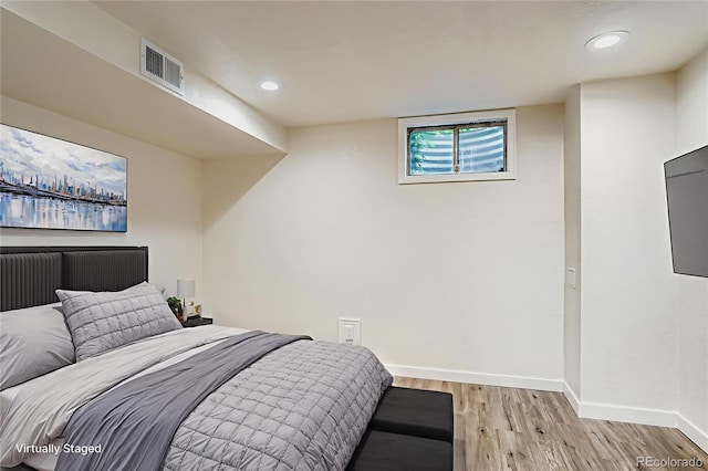 15775 E 13th Pl, Aurora, CO 80011 - bedroom featuring light wood-style floors and recessed lighting