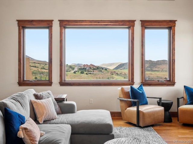 17121 Snow Creek Ln, Morrison, CO 80465 - living area with wood finished floors and a mountain view