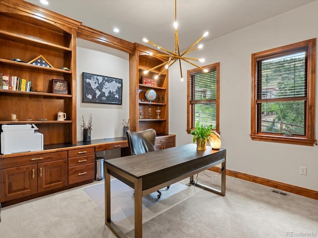 17121 Snow Creek Ln, Morrison, CO 80465 - office space featuring light colored carpet, a chandelier, and built in shelves