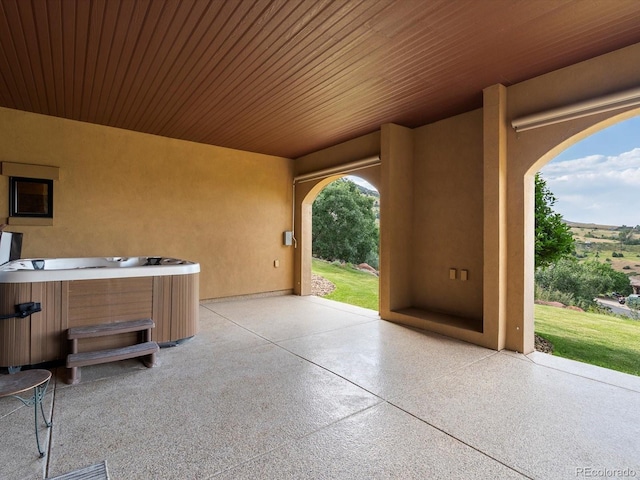 17121 Snow Creek Ln, Morrison, CO 80465 - view of patio / terrace with a hot tub