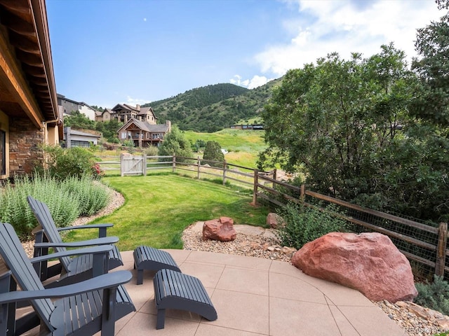 17121 Snow Creek Ln, Morrison, CO 80465 - fenced backyard featuring a mountain view and a patio