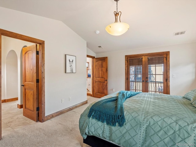 17121 Snow Creek Ln, Morrison, CO 80465 - bedroom with french doors, lofted ceiling, access to exterior, and light carpet