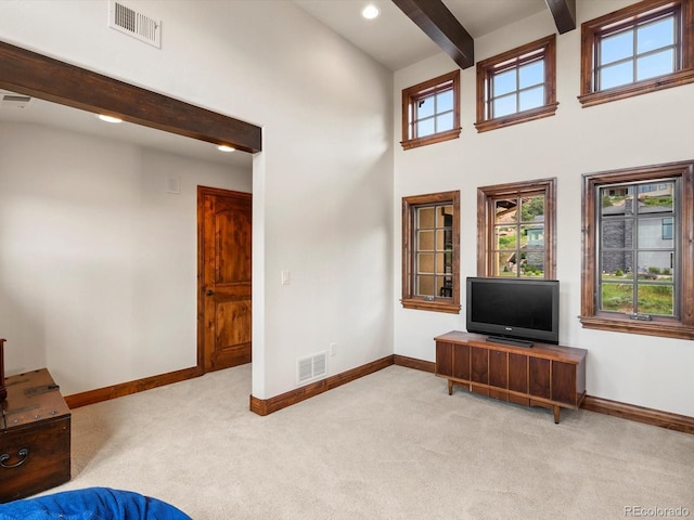 17121 Snow Creek Ln, Morrison, CO 80465 - unfurnished living room with carpet flooring, beamed ceiling, a high ceiling, and recessed lighting