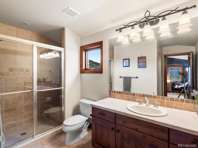 17121 Snow Creek Ln, Morrison, CO 80465 - full bathroom featuring vanity, a shower stall, and tile patterned flooring