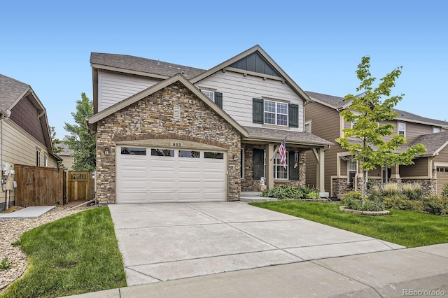 853 Jenny Ln, Berthoud, CO 80513 - view of front of house featuring stone siding, driveway, and an attached garage