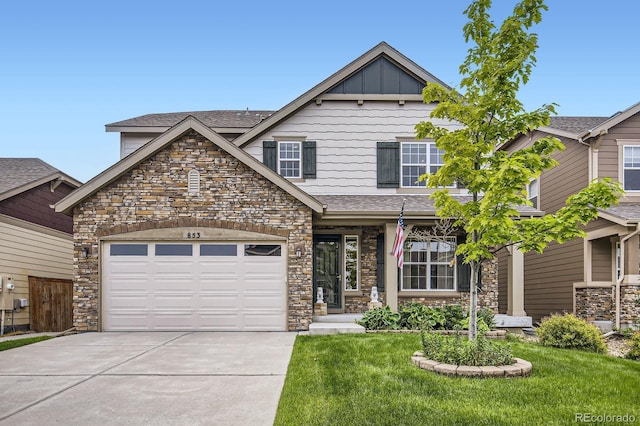 853 Jenny Ln, Berthoud, CO 80513 - craftsman-style home featuring stone siding, driveway, a front lawn, a shingled roof, and an attached garage