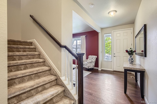853 Jenny Ln, Berthoud, CO 80513 - foyer entrance with stairs, dark wood finished floors, and baseboards