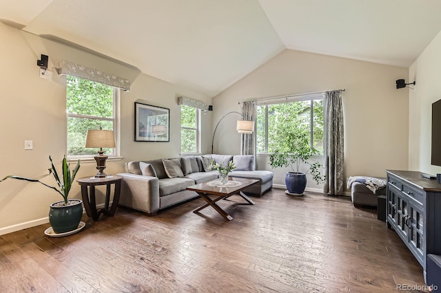 853 Jenny Ln, Berthoud, CO 80513 - living room featuring vaulted ceiling, hardwood / wood-style flooring, and baseboards