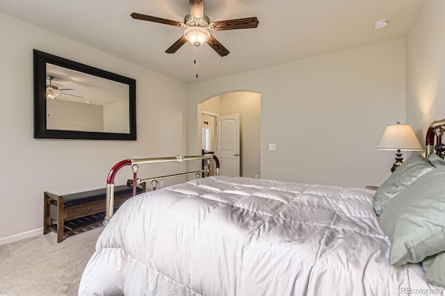 853 Jenny Ln, Berthoud, CO 80513 - bedroom with arched walkways, carpet floors, baseboards, and a ceiling fan