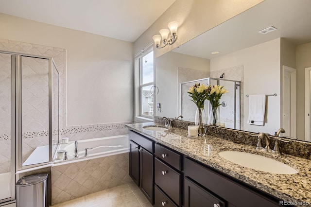 853 Jenny Ln, Berthoud, CO 80513 - full bathroom featuring a garden tub, double vanity, a stall shower, and tile patterned flooring