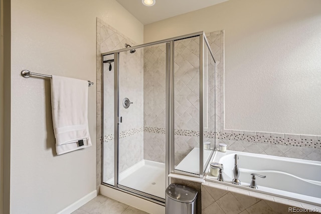 853 Jenny Ln, Berthoud, CO 80513 - bathroom featuring a bath, a stall shower, and tile patterned flooring