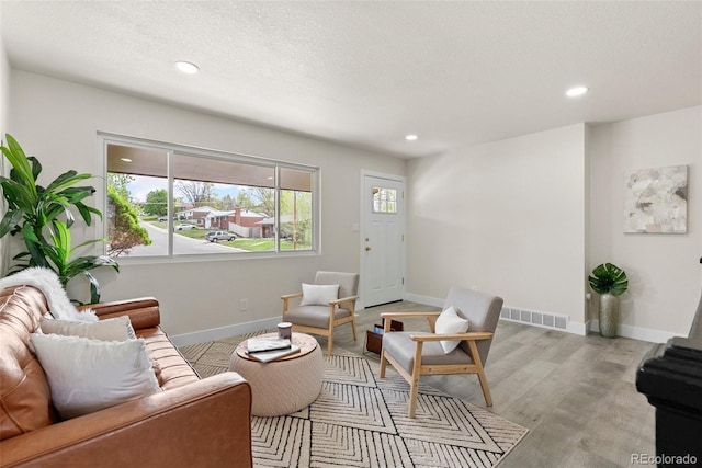 7961 Granada Rd, Denver, CO 80221 - living room featuring recessed lighting, light wood-type flooring, and baseboards