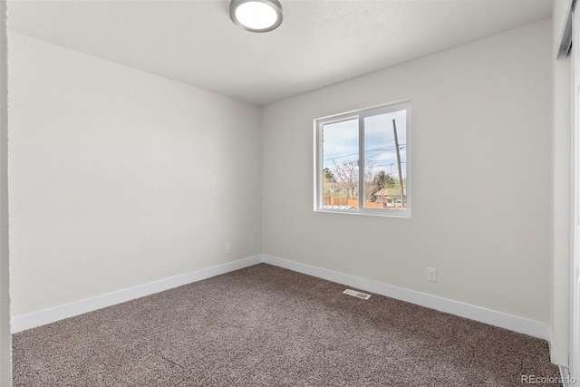 7961 Granada Rd, Denver, CO 80221 - spare room featuring dark carpet and baseboards
