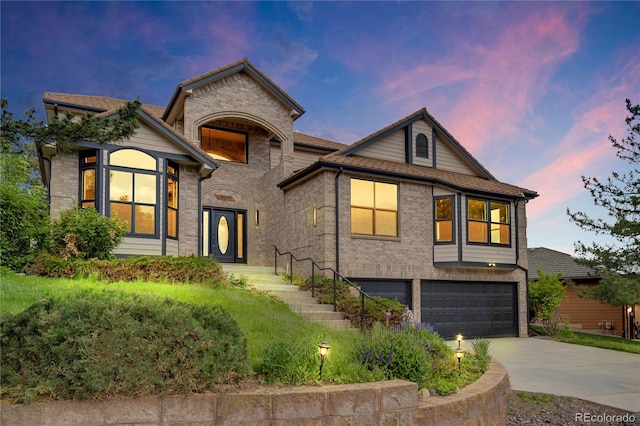 5569 Willow Springs Dr, Morrison, CO 80465 - view of front of home featuring an attached garage and driveway