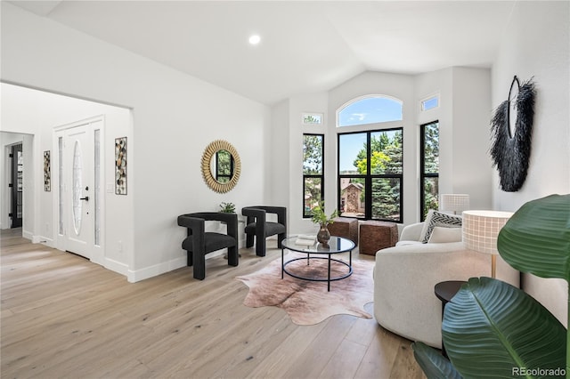 5569 Willow Springs Dr, Morrison, CO 80465 - living area featuring vaulted ceiling, light wood-style floors, and recessed lighting