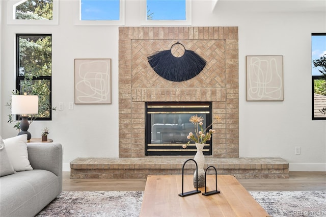 5569 Willow Springs Dr, Morrison, CO 80465 - living area with wood finished floors and a fireplace