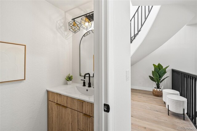 5569 Willow Springs Dr, Morrison, CO 80465 - bathroom featuring vanity and wood finished floors