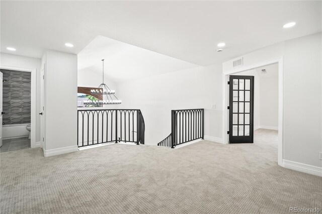 5569 Willow Springs Dr, Morrison, CO 80465 - carpeted empty room featuring recessed lighting, a chandelier, and lofted ceiling