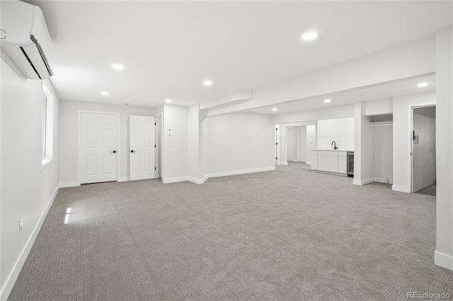 5569 Willow Springs Dr, Morrison, CO 80465 - below grade area with an AC wall unit, light colored carpet, recessed lighting, wet bar, and beverage cooler